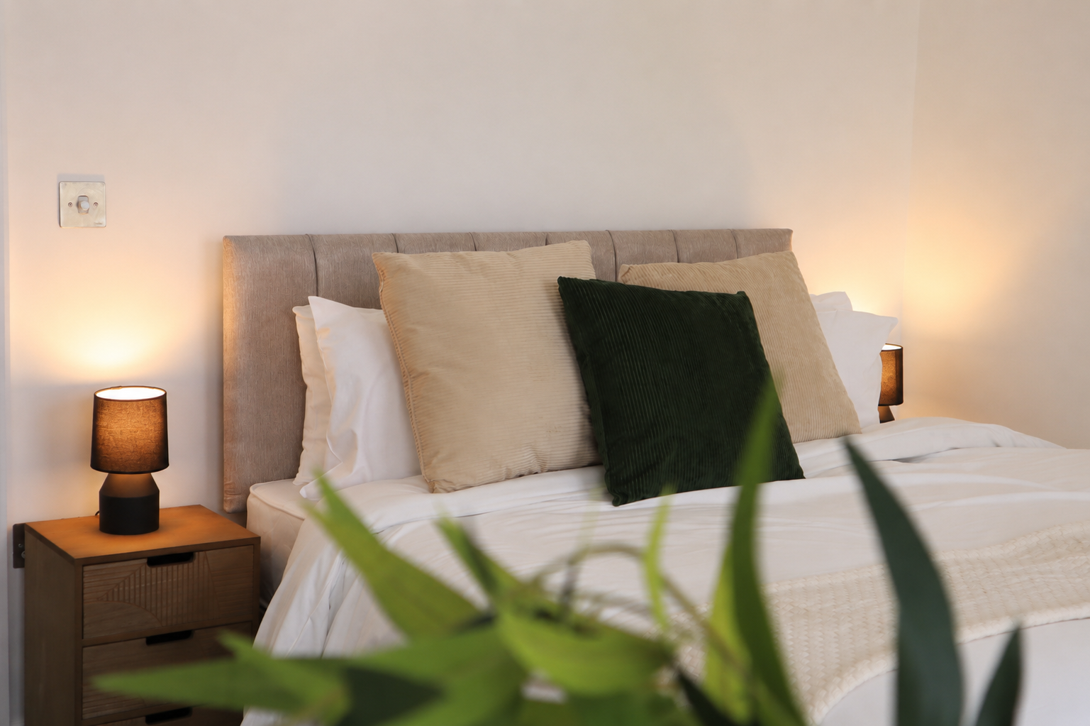 Brighton Lanes Retreat — bedroom detail with warm lamplight